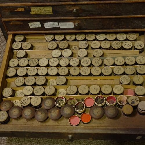 468 - HOROLOGY INTEREST - a watchmaker's double-bank chest of drawers and contents, including parts, movem... 