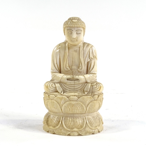 315 - A 19th century Chinese carved ivory seated Buddha, height 10cm