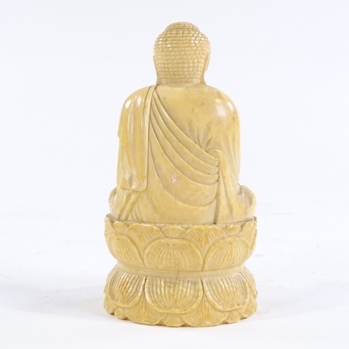 315 - A 19th century Chinese carved ivory seated Buddha, height 10cm