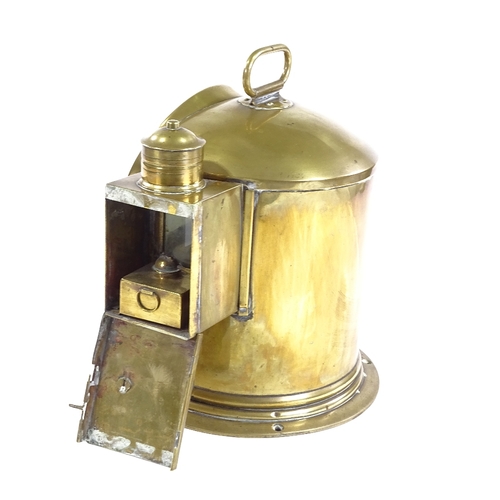 318 - A 19th century ship's brass binnacle containing a gimballed compass, height excluding handle 23cm