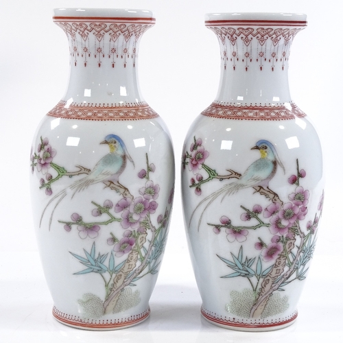 168 - A pair of Chinese Republic porcelain vases, hand painted birds and blossom, height 21cm