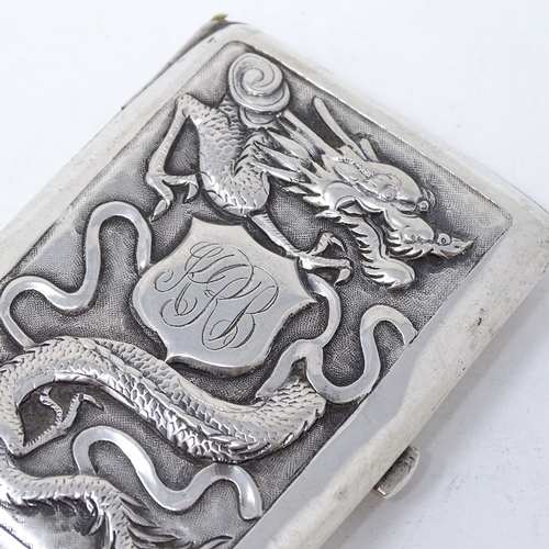 819 - A Chinese silver cigarette case, with relief embossed dragon and flower decoration, stamped on butto... 