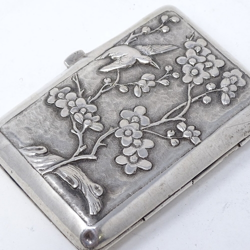 819 - A Chinese silver cigarette case, with relief embossed dragon and flower decoration, stamped on butto... 