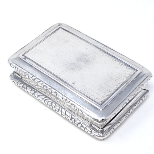 822 - A William IV rectangular silver snuffbox, with relief embossed floral decoration and engine turned b... 