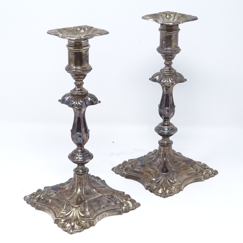 826 - A pair of silver candlesticks, by Harrods Ltd, hallmarks Sheffield 1958, height 23cm, loaded bases