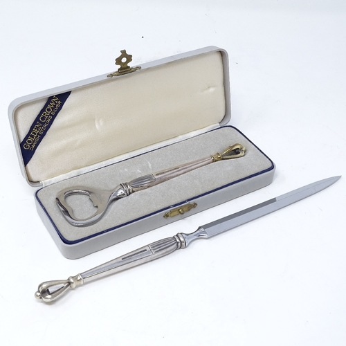 837 - A cased golden crown silver-handled bottle opener, length 14cm, and matching paper knife, by W S Sor... 