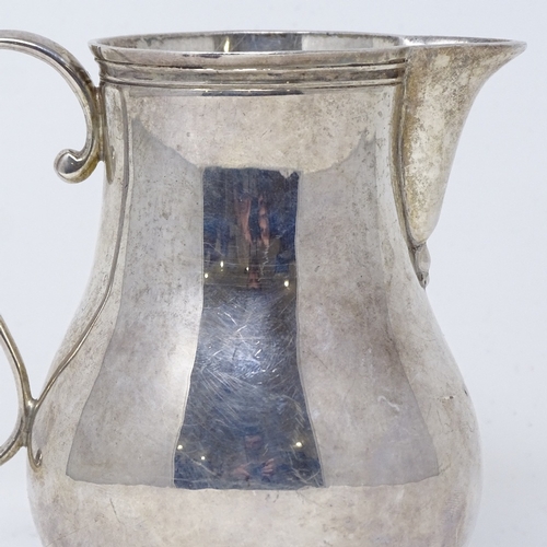 842 - A small silver baluster cream jug, by Rodney C Pettit, hallmarks London 1972, height 10cm, 5.6oz