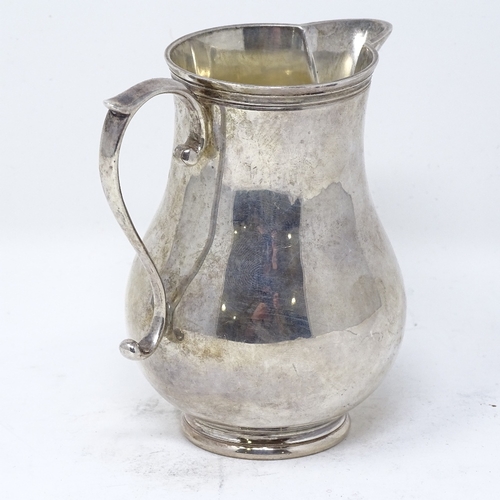 842 - A small silver baluster cream jug, by Rodney C Pettit, hallmarks London 1972, height 10cm, 5.6oz