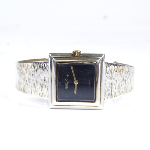 377 - ROY KING - a sterling silver designer mechanical bangle wristwatch, black dial with square stepped c... 