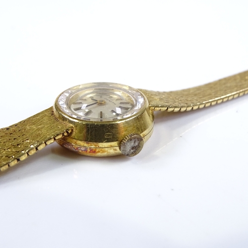 381 - ZENITH - a lady's 18ct gold mechanical wristwatch, silvered dial with baton hour markers, on 18ct te... 