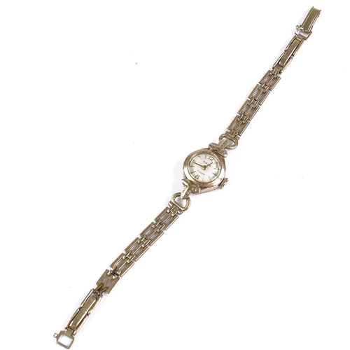 399 - EMKA - a lady's 9ct gold mechanical wristwatch, 21 jewel movement with baton hour markers on 9ct str... 