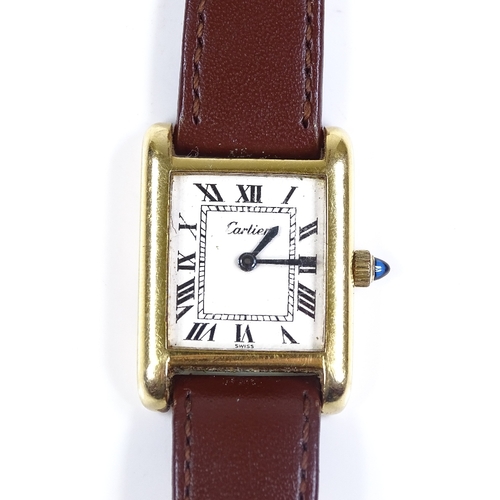 400 - CARTIER - a lady's gold plated Tank quartz wristwatch, white dial with Roman numeral hour markers, b... 