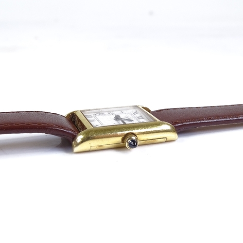 400 - CARTIER - a lady's gold plated Tank quartz wristwatch, white dial with Roman numeral hour markers, b... 