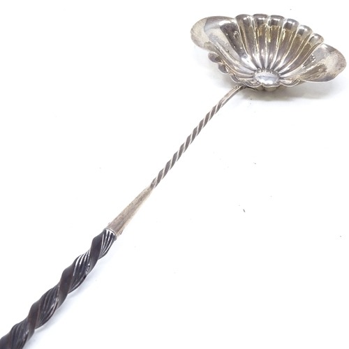 850 - A French silver toddy ladle, with twisted whale-bone handle, length 38cm