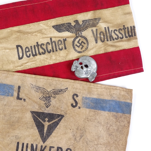 325 - 2 German Junkers and Volkstrun armbands, and a metal badge (3)