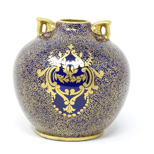 310 - Robert Allen Studios for Royal Doulton, small globular vase with hand painted scene in blue and gold... 