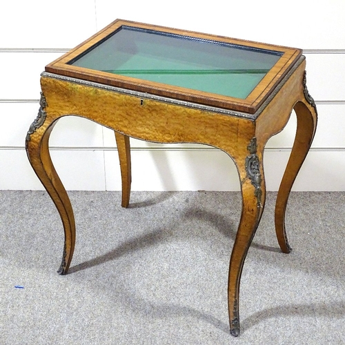 328 - A 19th century maple and kingwood vitrine table, with ormolu mouldings and mounts, and cabriole legs... 