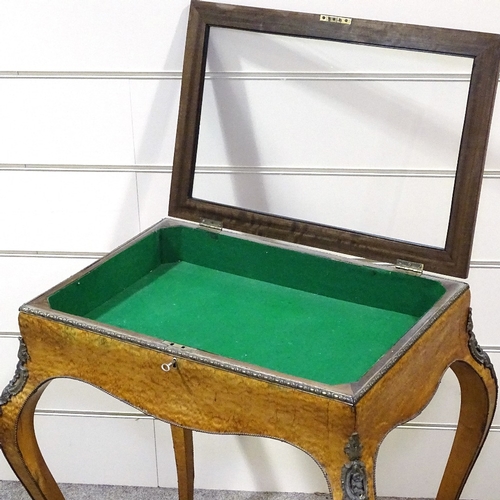 328 - A 19th century maple and kingwood vitrine table, with ormolu mouldings and mounts, and cabriole legs... 