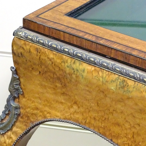 328 - A 19th century maple and kingwood vitrine table, with ormolu mouldings and mounts, and cabriole legs... 