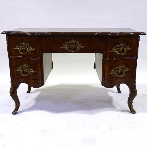 329 - An 18th century Italian (possibly Maltese) walnut desk, shaped moulded and banded top, with shaped c... 