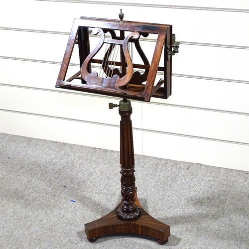 331 - A William IV rosewood duet music stand with brass candle brackets, reeded tulip carved and turned ce... 