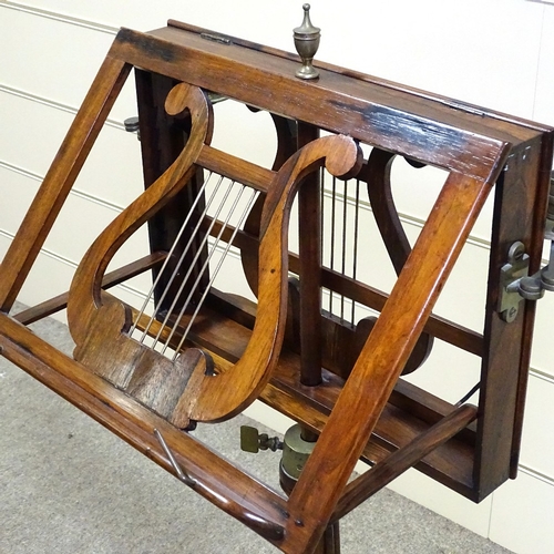 331 - A William IV rosewood duet music stand with brass candle brackets, reeded tulip carved and turned ce... 