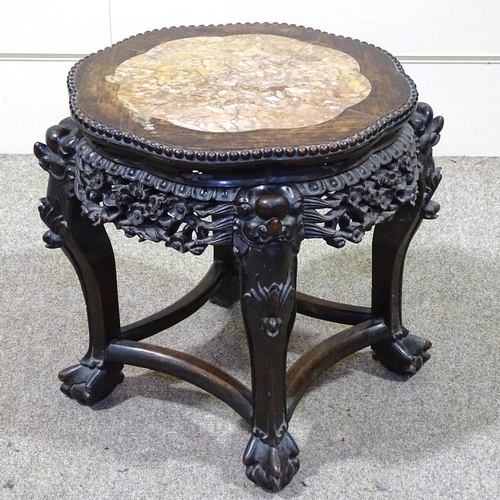 332 - A Chinese 19th century carved hardwood low table, with inset marble top and carved and pierced friez... 