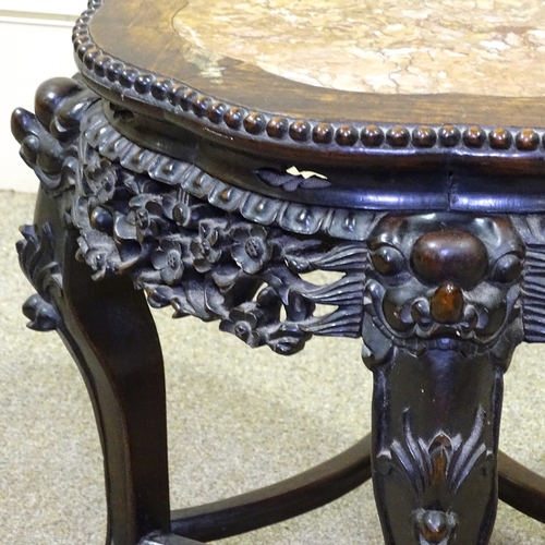 332 - A Chinese 19th century carved hardwood low table, with inset marble top and carved and pierced friez... 