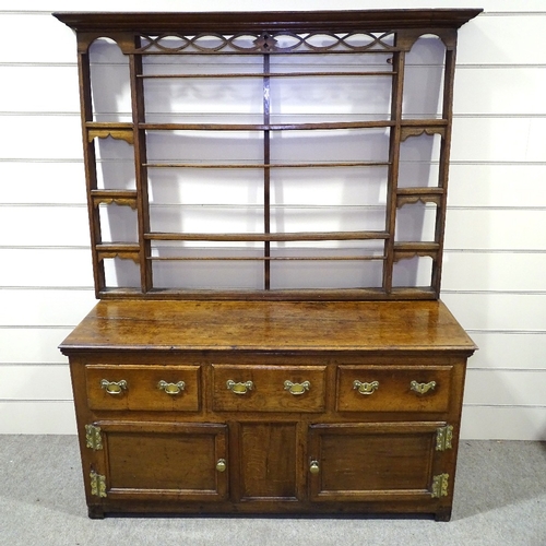 335 - An Antique oak dresser with open plate rack, 3 frieze drawers and panelled cupboards under, length 5... 