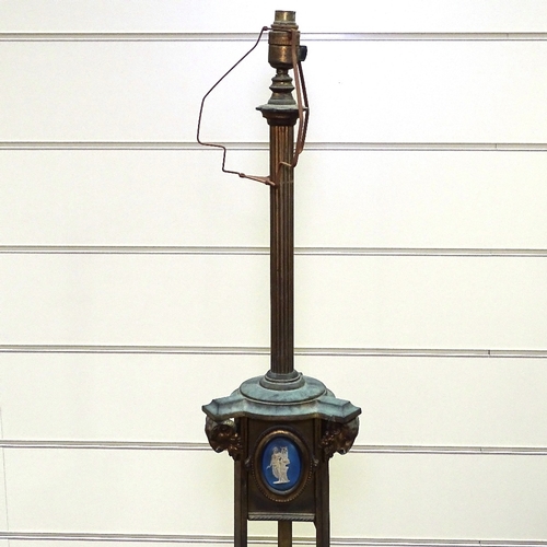 342 - A 19th century gilt-bronze standard lamp, with inset Wedgwood plaques and ram's head mounts