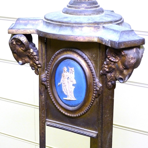 342 - A 19th century gilt-bronze standard lamp, with inset Wedgwood plaques and ram's head mounts