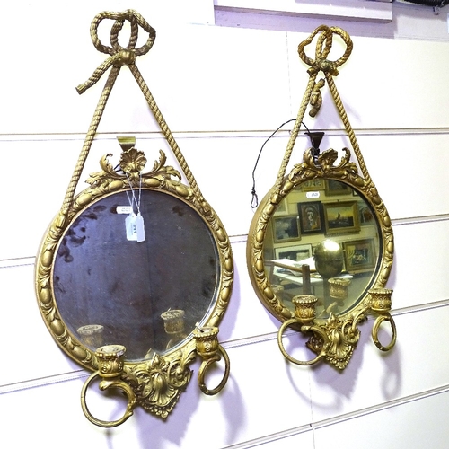 344 - A pair of Victorian gilt-gesso framed wall mirrors, with twin candle brackets, overall height 2'2