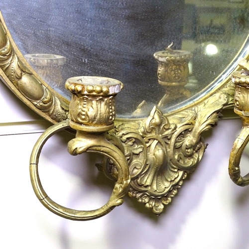 344 - A pair of Victorian gilt-gesso framed wall mirrors, with twin candle brackets, overall height 2'2