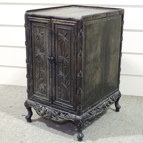 345 - A 19th century Chinese hardwood side cupboard, with relief carved bamboo decorated doors, width 18