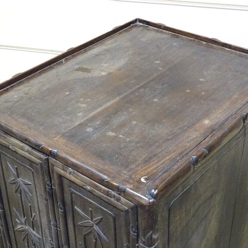 345 - A 19th century Chinese hardwood side cupboard, with relief carved bamboo decorated doors, width 18