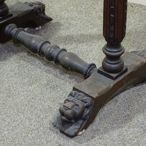 346 - A Victorian carved oak sewing box on stand with high relief carved decoration, on lion mask feet, wi... 