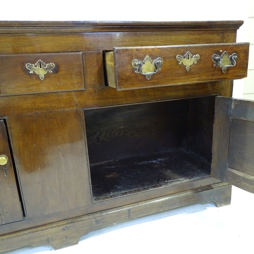 348 - An 18th century American (Virginian) walnut dresser, with boarded open plate rack above, 3 frieze dr... 