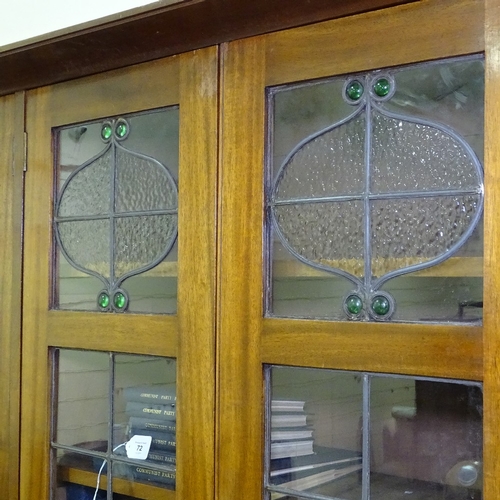 349 - An early 20th century mahogany library bookcase with leadlight glaze panelled cupboards above, friez... 