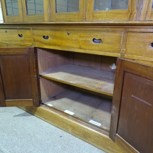 349 - An early 20th century mahogany library bookcase with leadlight glaze panelled cupboards above, friez... 