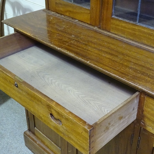 349 - An early 20th century mahogany library bookcase with leadlight glaze panelled cupboards above, friez... 