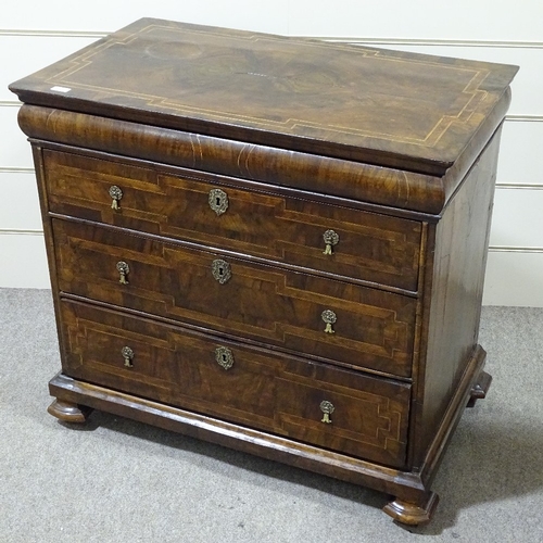 349B - An 18th century walnut chest of 3 long drawers, with feather-banded and quarter veneered top, concea... 