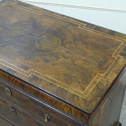 349B - An 18th century walnut chest of 3 long drawers, with feather-banded and quarter veneered top, concea... 