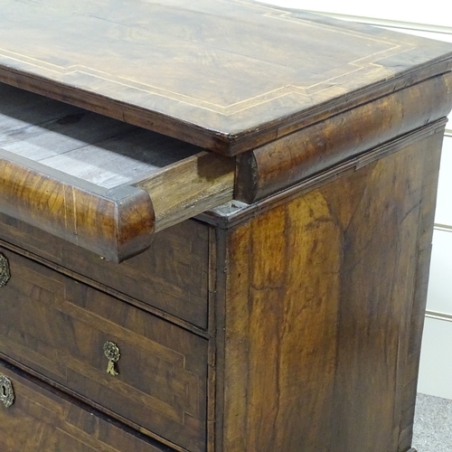 349B - An 18th century walnut chest of 3 long drawers, with feather-banded and quarter veneered top, concea... 