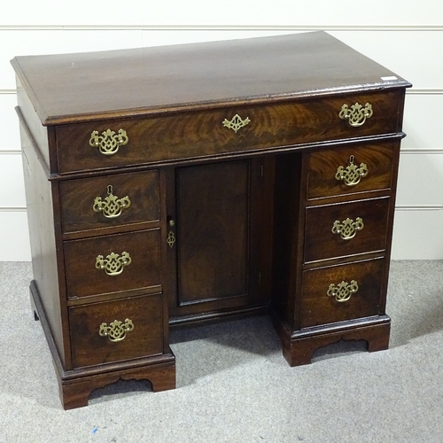 349C - A George III mahogany knee-hole desk with alcove cupboard, width 3'1