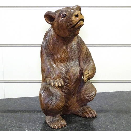 349E - A carved hardwood Black Forest style standing bear, height 17