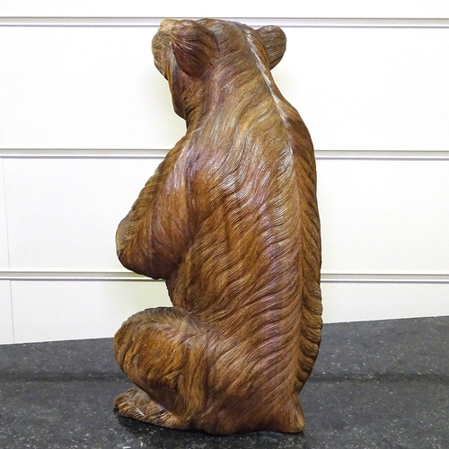 349E - A carved hardwood Black Forest style standing bear, height 17