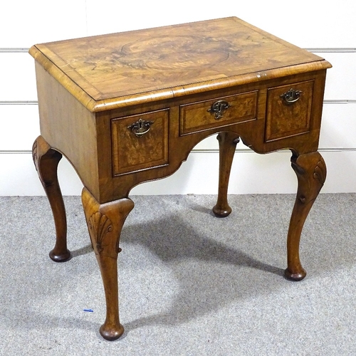 349F - A walnut lowboy with 3 frieze drawers and carved cabriole legs, width 2'5