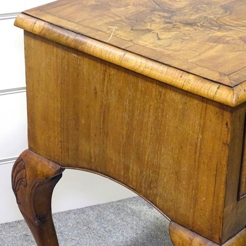 349F - A walnut lowboy with 3 frieze drawers and carved cabriole legs, width 2'5