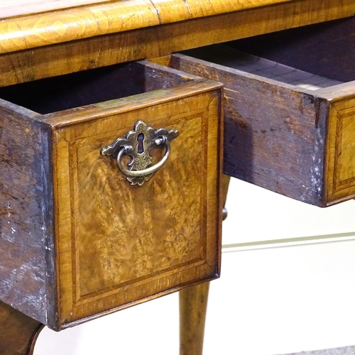 349F - A walnut lowboy with 3 frieze drawers and carved cabriole legs, width 2'5