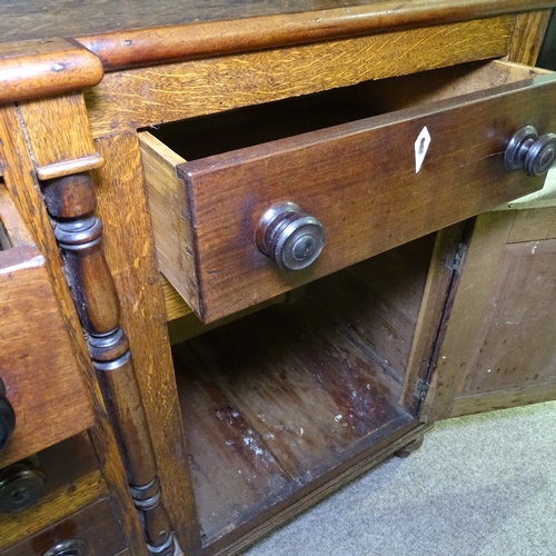 349K - A George III oak and mahogany break-front Anglesea Welsh dresser, with boarded open plate rack and d... 